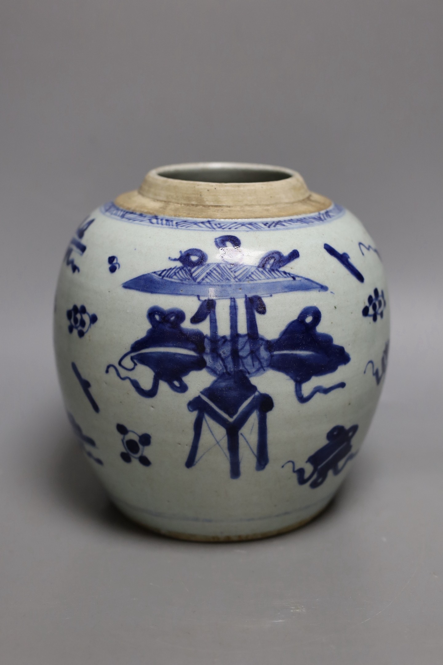 An 18th century Chinese provincial blue and white ‘Hundred Antiques’ jar, 18cm